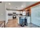 Modern kitchen with white cabinets, a center island with seating, and stainless steel appliances at 1048 Menands Ave, Las Vegas, NV 89123