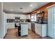 Charming kitchen with modern appliances, a functional island, and bar seating at 1048 Menands Ave, Las Vegas, NV 89123