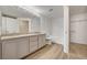 Spacious bathroom featuring double vanity, granite countertop, and shower-tub combo at 10550 W Alexander Rd # 2220, Las Vegas, NV 89129