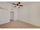 Bedroom featuring neutral carpet, ceiling fan, closet entry, and electrical outlets at 10550 W Alexander Rd # 2220, Las Vegas, NV 89129