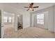 Bright bedroom featuring neutral carpeting, a ceiling fan, and a window for natural light at 10550 W Alexander Rd # 2220, Las Vegas, NV 89129