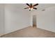 Simple bedroom space featuring neutral carpet, ceiling fan, and lots of natural light at 10550 W Alexander Rd # 2220, Las Vegas, NV 89129