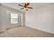 Bright bedroom featuring ceiling fan, neutral carpet and ample natural light at 10550 W Alexander Rd # 2220, Las Vegas, NV 89129