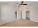 Bedroom featuring neutral carpet, ceiling fan, and connected bathroom and closet at 10550 W Alexander Rd # 2220, Las Vegas, NV 89129