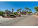 View of entrance to Chateau Versailles community featuring lush landscaping at 10550 W Alexander Rd # 2220, Las Vegas, NV 89129