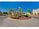 Gated entrance with water feature, desert landscaping, and beautiful tile street at 10550 W Alexander Rd # 2220, Las Vegas, NV 89129