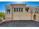 Beautiful two-story townhome with a two-car garage and decorative architectural details at 10550 W Alexander Rd # 2220, Las Vegas, NV 89129
