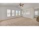 Expansive living room featuring vaulted ceilings, neutral carpet and an abundance of light at 10550 W Alexander Rd # 2220, Las Vegas, NV 89129