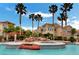 Resort style pool with waterfalls, spa, and poolside lounge seating at 10550 W Alexander Rd # 2220, Las Vegas, NV 89129