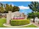 Chateau Versailles community sign with manicured landscaping and blue sky at 10550 W Alexander Rd # 2220, Las Vegas, NV 89129