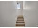 Well-lit stairway with a small window and neutral carpeting at 10550 W Alexander Rd # 2220, Las Vegas, NV 89129