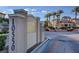Well-maintained community street view, with lush landscaping, and palm trees at 10550 W Alexander Rd # 2220, Las Vegas, NV 89129