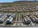 Aerial view of community with houses, palm trees, and desert landscaping at 11239 Cactus Tower Ave # 102, Las Vegas, NV 89135