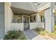 Charming front entrance with stone walkway, gated porch, decorative planters, and neutral color palette at 11239 Cactus Tower Ave # 102, Las Vegas, NV 89135
