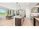 Modern kitchen with stainless steel appliances, quartz countertops, and eat in dining area offers a stylish and functional space at 11239 Cactus Tower Ave # 102, Las Vegas, NV 89135