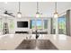 Bright eat-in kitchen with stainless steel sink and modern faucet with natural light from the numerous windows and sliding glass door at 11239 Cactus Tower Ave # 102, Las Vegas, NV 89135