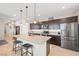 Spacious kitchen with stainless steel appliances, a large island with seating, and modern cabinetry at 11239 Cactus Tower Ave # 102, Las Vegas, NV 89135