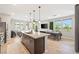 Bright living area boasts an open floor plan seamlessly connecting kitchen, dining area, and living space, perfect for modern living at 11239 Cactus Tower Ave # 102, Las Vegas, NV 89135