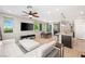 Bright living area boasts an open floor plan seamlessly connecting kitchen, dining area, and living space, perfect for modern living at 11239 Cactus Tower Ave # 102, Las Vegas, NV 89135