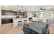 Open concept living space featuring a kitchen island, dining area, and contemporary furnishings at 11239 Cactus Tower Ave # 102, Las Vegas, NV 89135