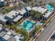 Overhead community pool view with palm trees, seating, and modern architecture at 11239 Cactus Tower Ave # 102, Las Vegas, NV 89135