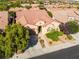 Aerial view of a lovely single-story home with a well-maintained yard and a peaceful neighborhood setting at 12276 Caminita Pl, Las Vegas, NV 89138