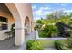 Inviting backyard with lush landscaping and covered patio, perfect for outdoor entertaining and relaxation at 12276 Caminita Pl, Las Vegas, NV 89138