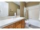 Bathroom featuring a tub-shower combo, vanity with sink, and tile flooring for a functional and clean space at 12276 Caminita Pl, Las Vegas, NV 89138
