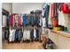 Walk-in closet with plentiful storage and organization options, perfect for maximizing space and keeping items tidy at 12276 Caminita Pl, Las Vegas, NV 89138