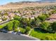 Overhead shot of neighborhood with lush park and walking trails in established community at 12276 Caminita Pl, Las Vegas, NV 89138