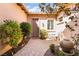 Private front courtyard with pavers, accent plants, and comfortable seating space at 12276 Caminita Pl, Las Vegas, NV 89138