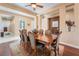 Elegant dining room with a large wood table, decorative chairs, and classic details at 12276 Caminita Pl, Las Vegas, NV 89138