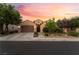 Inviting single-story home with desert landscaping, two-car garage, and warm exterior lighting at sunset at 12276 Caminita Pl, Las Vegas, NV 89138