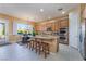 Bright kitchen boasts granite counters, stainless appliances, wood cabinets and a cozy breakfast nook at 12276 Caminita Pl, Las Vegas, NV 89138