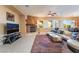 Cozy living room featuring a fireplace, comfortable seating, and an open floor plan at 12276 Caminita Pl, Las Vegas, NV 89138