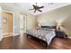 Spacious main bedroom with hardwood floors, neutral walls, and ensuite bathroom access at 12276 Caminita Pl, Las Vegas, NV 89138