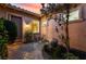 Charming courtyard featuring brick pavers, bistro seating, and mature landscaping for outdoor enjoyment at 12276 Caminita Pl, Las Vegas, NV 89138