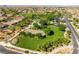 Community park with lush green spaces, basketball court, and walking paths for outdoor enjoyment at 12276 Caminita Pl, Las Vegas, NV 89138