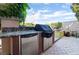 Outdoor kitchen area with a built-in grill, mini fridge, and countertop space, perfect for outdoor entertaining at 12276 Caminita Pl, Las Vegas, NV 89138