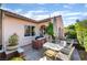 Charming outdoor space with a dining table, built-in grill, and beautiful landscaping, perfect for entertaining at 12276 Caminita Pl, Las Vegas, NV 89138