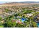 Aerial view of the community park featuring a playground, picnic areas, and green space at 12276 Caminita Pl, Las Vegas, NV 89138