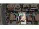 Aerial perspective featuring houses with pools, solar panels, and palm trees in a residential area at 1877 Glory Lily Ct, Las Vegas, NV 89123