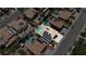 Aerial photo capturing a community with homes featuring pools, solar panels, and attractive outdoor spaces at 1877 Glory Lily Ct, Las Vegas, NV 89123