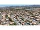 Wide aerial perspective of a suburban area with houses, roads, and distant mountain views at 1877 Glory Lily Ct, Las Vegas, NV 89123