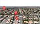 Expansive aerial view showcasing a neighborhood with well-maintained homes and lush landscaping at 1877 Glory Lily Ct, Las Vegas, NV 89123
