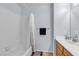 Bright bathroom featuring a shower-tub combination and single sink vanity at 1877 Glory Lily Ct, Las Vegas, NV 89123