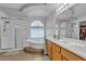 Bathroom featuring a glass shower, bathtub, and double sink vanity at 1877 Glory Lily Ct, Las Vegas, NV 89123