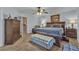 Spacious bedroom with traditional furnishings including a wooden bed frame and dresser at 1877 Glory Lily Ct, Las Vegas, NV 89123