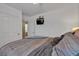 Cozy bedroom featuring a ceiling fan and television at 1877 Glory Lily Ct, Las Vegas, NV 89123