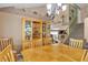 Spacious dining room with a large wooden table, china cabinet, and staircase, perfect for Gathering gatherings at 1877 Glory Lily Ct, Las Vegas, NV 89123